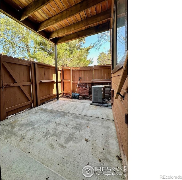 9501 W 89th Cir, Broomfield, CO 80021 - view of patio / terrace with central AC, fence, and a gate