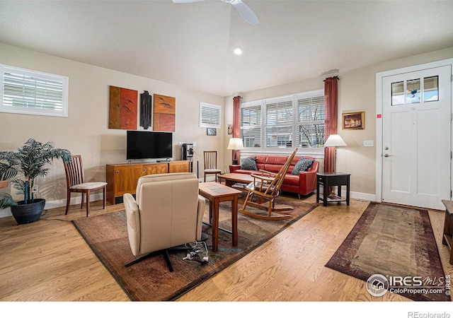 living room with baseboards, wood finished floors, ceiling fan, and recessed lighting