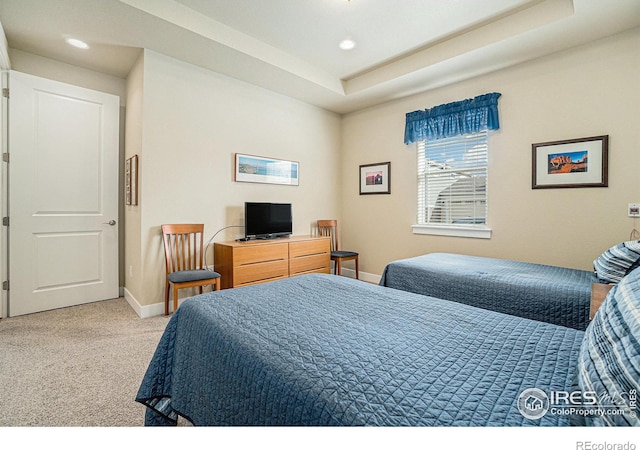 bedroom with baseboards, carpet floors, a tray ceiling, and recessed lighting