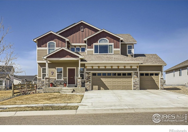 5460 Homeward Dr, Timnath, CO 80547 - craftsman house featuring concrete driveway, stone siding, board and batten siding, and an attached garage