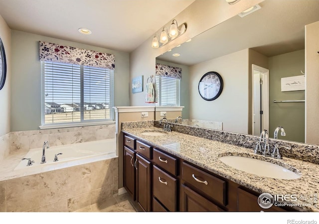 5460 Homeward Dr, Timnath, CO 80547 - bathroom with a garden tub, double vanity, and recessed lighting