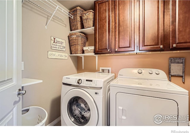 5460 Homeward Dr, Timnath, CO 80547 - clothes washing area featuring washer and dryer and cabinet space