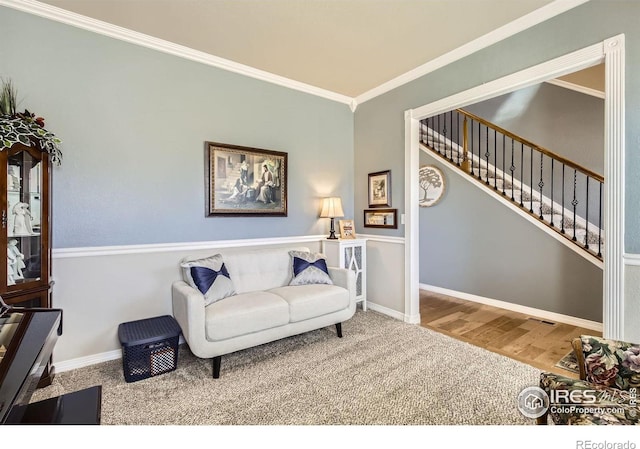 5460 Homeward Dr, Timnath, CO 80547 - living room with ornamental molding, carpet floors, baseboards, stairway, and wood finished floors