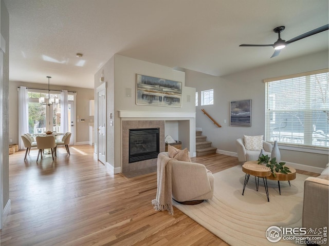 2946 Shoshone Trl, Lafayette, CO 80026 - living room with light wood-style floors, plenty of natural light, and stairway