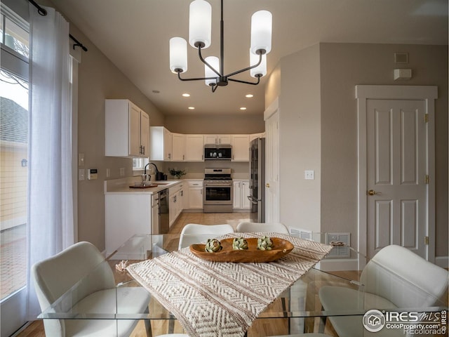2946 Shoshone Trl, Lafayette, CO 80026 - dining room featuring recessed lighting, baseboards, a chandelier, and visible vents
