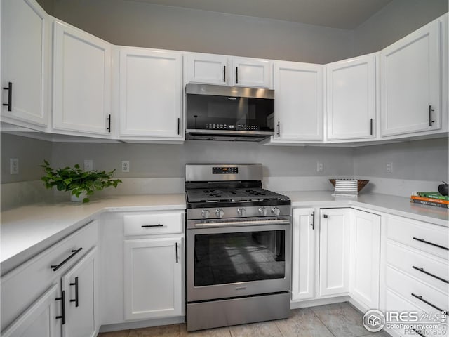 2946 Shoshone Trl, Lafayette, CO 80026 - kitchen featuring light countertops, white cabinets, and stainless steel appliances