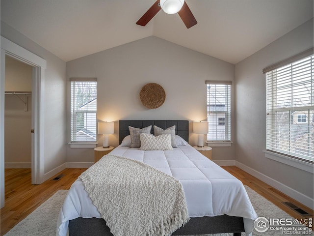 2946 Shoshone Trl, Lafayette, CO 80026 - bedroom with a spacious closet, baseboards, wood finished floors, and visible vents