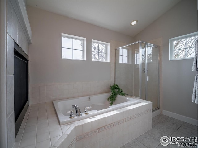 2946 Shoshone Trl, Lafayette, CO 80026 - full bath featuring a healthy amount of sunlight, a bath, and a stall shower