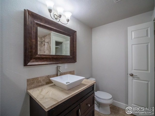 2946 Shoshone Trl, Lafayette, CO 80026 - full bathroom with vanity, a textured ceiling, a shower, and toilet