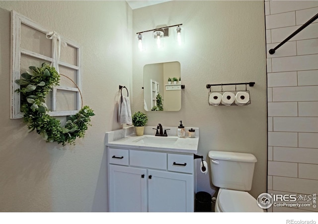 27857 Hopi Trl, Loveland, CO 80534 - full bathroom featuring toilet and vanity