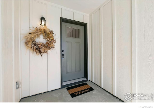 3362 Buffalo Grass Ln, Wellington, CO 80549 - doorway to property with board and batten siding