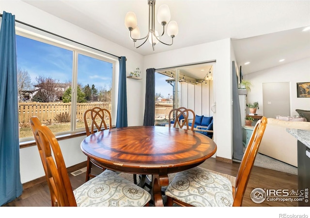 3362 Buffalo Grass Ln, Wellington, CO 80549 - dining space with wood finished floors, plenty of natural light, a chandelier, and recessed lighting