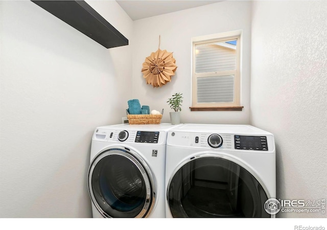 3362 Buffalo Grass Ln, Wellington, CO 80549 - laundry room featuring washing machine and dryer