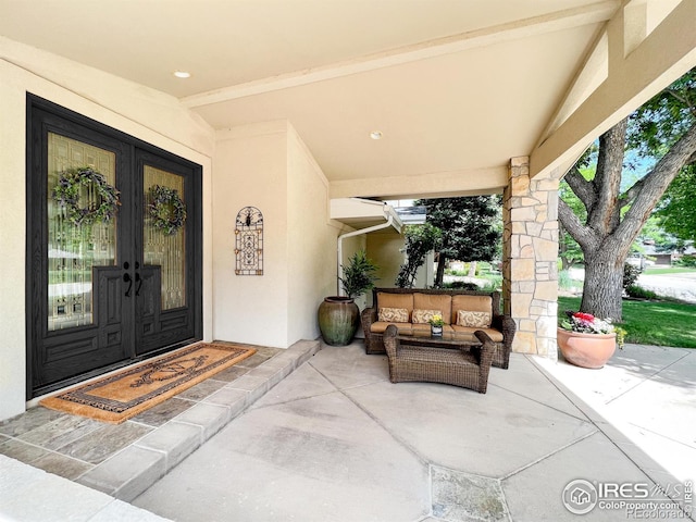 7155 Rustic Trl, Boulder, CO 80301 - entrance to property with stucco siding, an outdoor living space, a patio area, and french doors