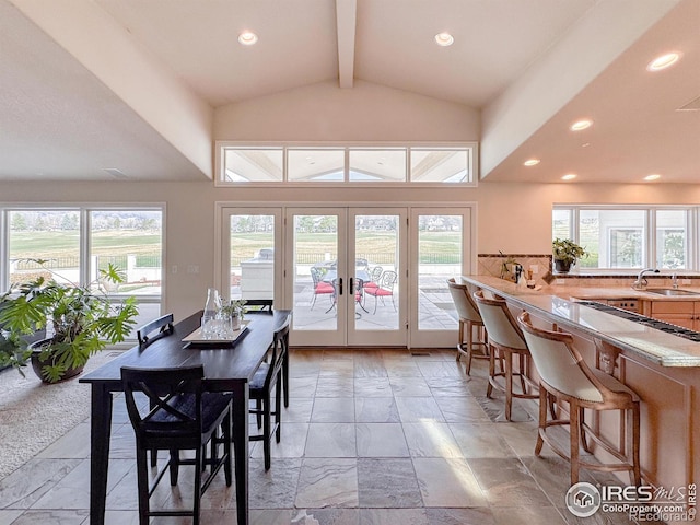 7155 Rustic Trl, Boulder, CO 80301 - dining space featuring beam ceiling, french doors, plenty of natural light, recessed lighting, and high vaulted ceiling