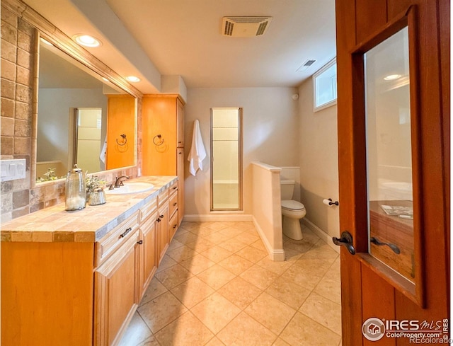 7155 Rustic Trl, Boulder, CO 80301 - full bath with toilet, vanity, tile patterned flooring, and baseboards