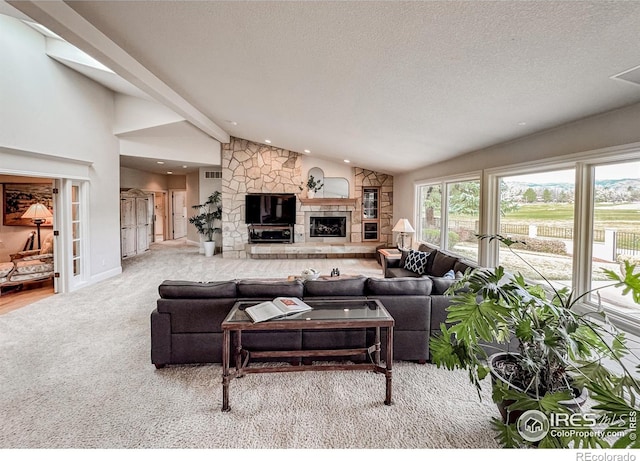 7155 Rustic Trl, Boulder, CO 80301 - carpeted living room featuring a fireplace, recessed lighting, and a textured ceiling