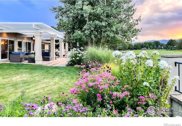 7155 Rustic Trl, Boulder, CO 80301 - yard at dusk with an outdoor hangout area, a pergola, a patio, and a yard