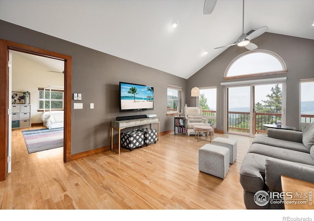 10435 Roan Mountain Rd, Loveland, CO 80538 - living room featuring baseboards, high vaulted ceiling, wood finished floors, and a ceiling fan