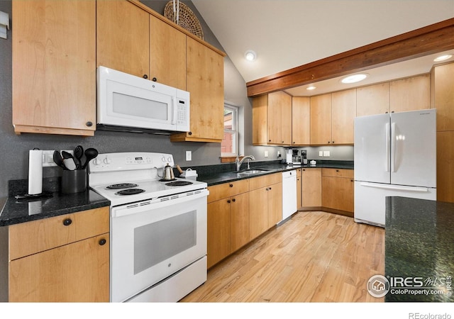 10435 Roan Mountain Rd, Loveland, CO 80538 - kitchen featuring white appliances, light brown cabinets, lofted ceiling, a sink, and light wood-type flooring