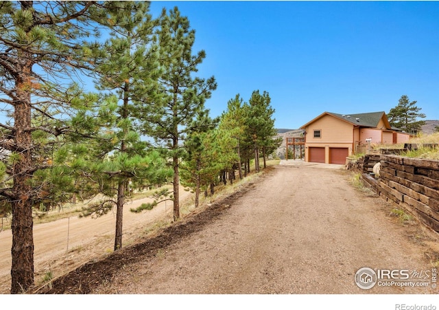10435 Roan Mountain Rd, Loveland, CO 80538 - view of street featuring dirt driveway