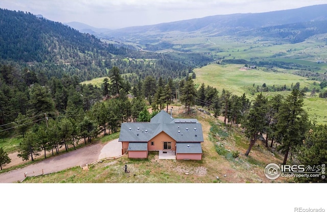 10435 Roan Mountain Rd, Loveland, CO 80538 - drone / aerial view with a wooded view and a mountain view