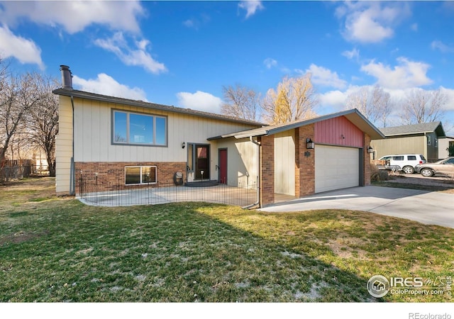 view of front of property featuring brick siding, a front yard, driveway, and an attached garage