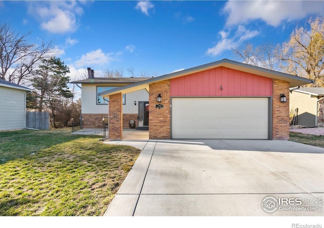 view of front of home with fence, an attached garage, concrete driveway, a front yard, and brick siding