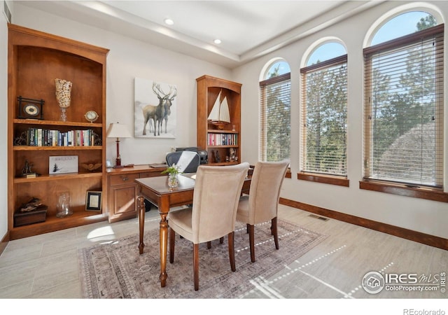 dining room featuring light wood-type flooring, visible vents, and recessed lighting