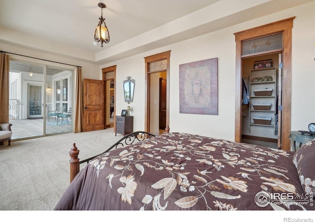 carpeted bedroom with access to outside