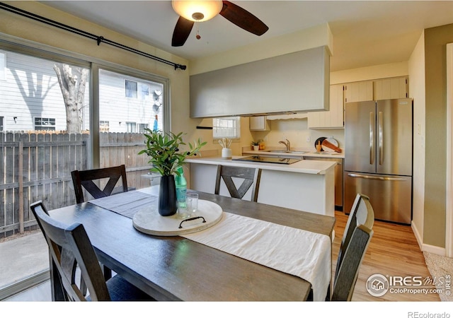 1865 Terry St Unit 3, Longmont, CO 80501 - dining space featuring baseboards, ceiling fan, and light wood finished floors