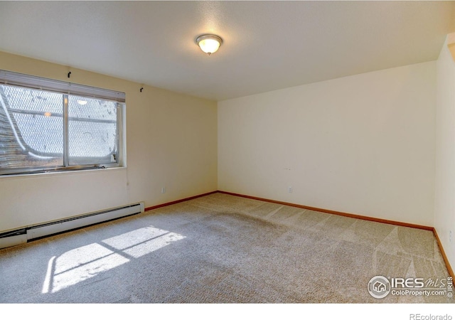 1865 Terry St Unit 3, Longmont, CO 80501 - empty room featuring a baseboard radiator, baseboards, and carpet flooring