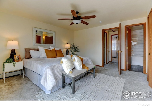 1865 Terry St Unit 3, Longmont, CO 80501 - bedroom with light colored carpet, baseboards, ensuite bath, a ceiling fan, and baseboard heating