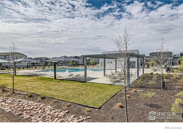 38 Morgan Cir S, Erie, CO 80516 - community pool featuring a lawn, a patio, and a pergola