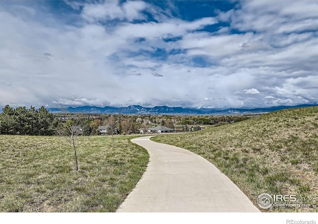 38 Morgan Cir S, Erie, CO 80516 - view of property's community with a mountain view and a lawn