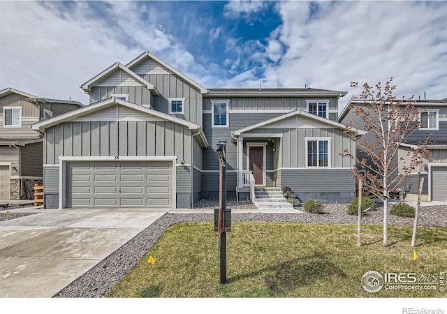 38 Morgan Cir S, Erie, CO 80516 - view of front of property featuring board and batten siding, an attached garage, concrete driveway, and a front yard