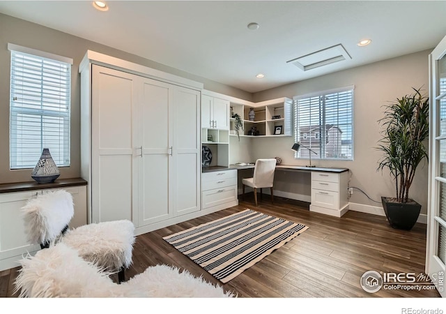 38 Morgan Cir S, Erie, CO 80516 - home office with built in desk, dark wood finished floors, recessed lighting, baseboards, and attic access