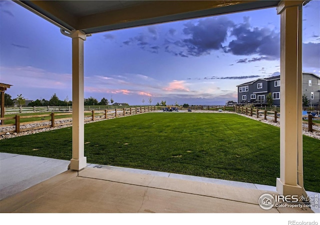 38 Morgan Cir S, Erie, CO 80516 - yard at dusk with a patio area