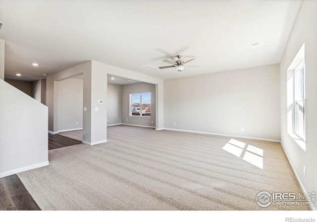974 Cascade Falls St, Severance, CO 80550 - unfurnished living room featuring healthy amount of natural light, a ceiling fan, carpet floors, and recessed lighting