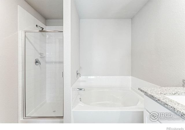 974 Cascade Falls St, Severance, CO 80550 - full bath with a garden tub, a stall shower, and vanity