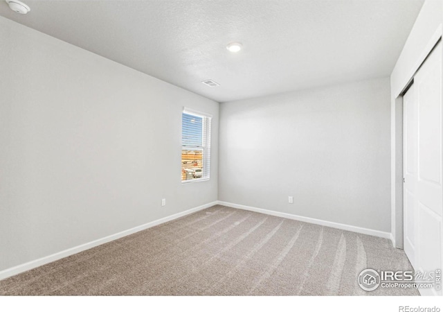 974 Cascade Falls St, Severance, CO 80550 - unfurnished bedroom with carpet flooring and a closet