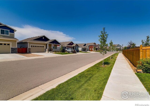 974 Cascade Falls St, Severance, CO 80550 - view of asphalt road with a residential view and sidewalks