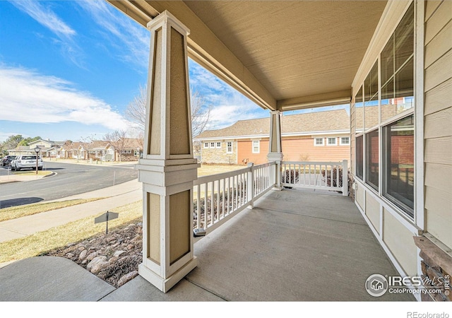 4751 Pleasant Oak Dr Unit C65, Fort Collins, CO 80525 - view of patio / terrace featuring a porch and a residential view