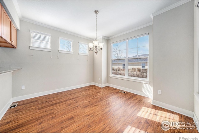 4751 Pleasant Oak Dr Unit C65, Fort Collins, CO 80525 - unfurnished dining area featuring ornamental molding, visible vents, a chandelier, and light wood finished floors