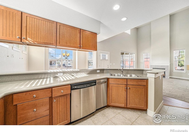 4751 Pleasant Oak Dr Unit C65, Fort Collins, CO 80525 - kitchen featuring a sink, brown cabinets, and stainless steel dishwasher