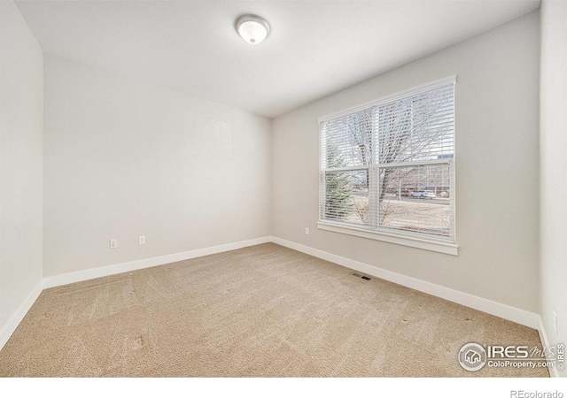 4751 Pleasant Oak Dr Unit C65, Fort Collins, CO 80525 - spare room featuring baseboards, carpet floors, and visible vents
