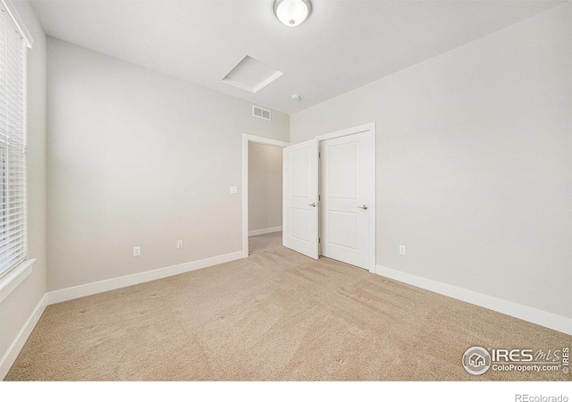 4751 Pleasant Oak Dr Unit C65, Fort Collins, CO 80525 - empty room featuring carpet flooring, baseboards, attic access, and visible vents