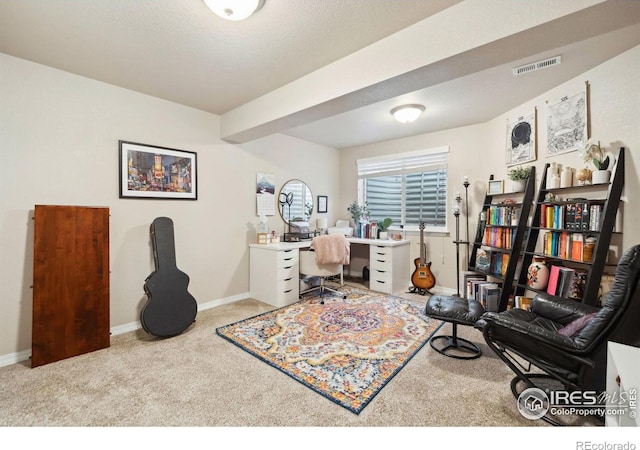 carpeted office space featuring baseboards and visible vents
