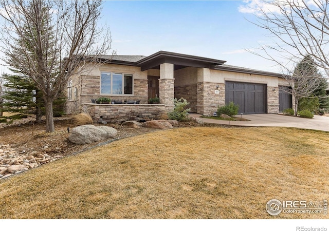 view of front of property with a front yard, stone siding, concrete driveway, stucco siding, and a garage