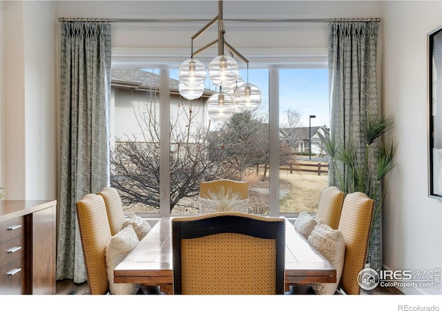 dining space with a chandelier